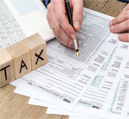 Visual showing taxpayer reviewing forms to resolve back taxes