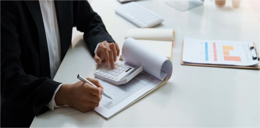 Graphic of documents and calculator representing tax amendment process